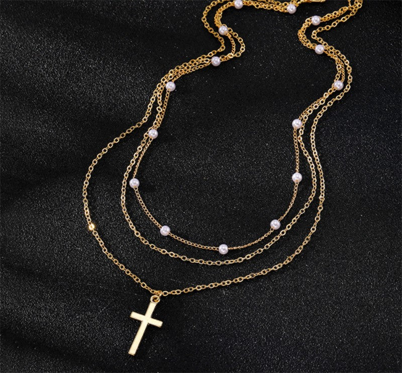 Gold necklace with cross pendant