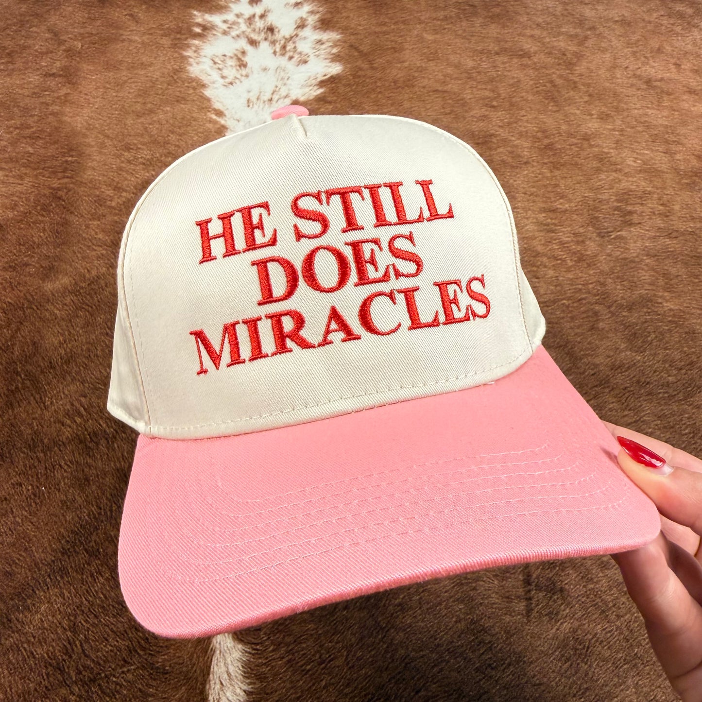 He Still Does Miracles Trucker Hat