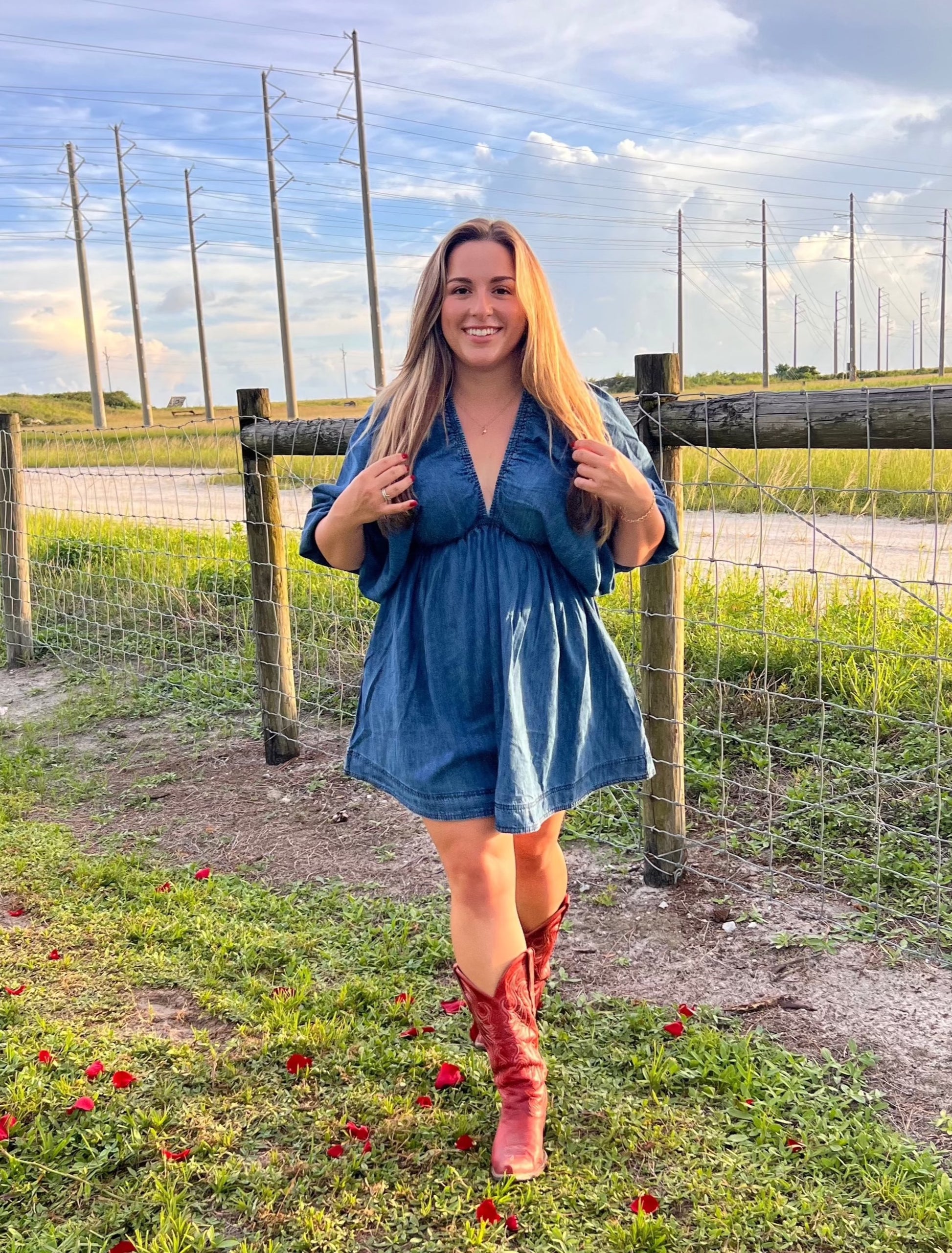 Denim western dress paired with red cowgirl boots