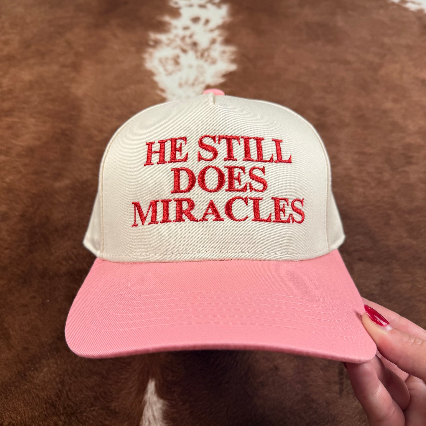 He Still Does Miracles Trucker Hat