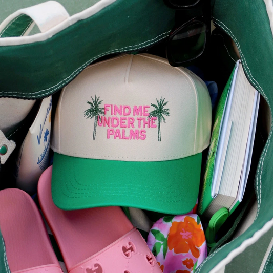 Women's Summer trucker hat with 'Find me under the palms' text. Summer vacation hats.