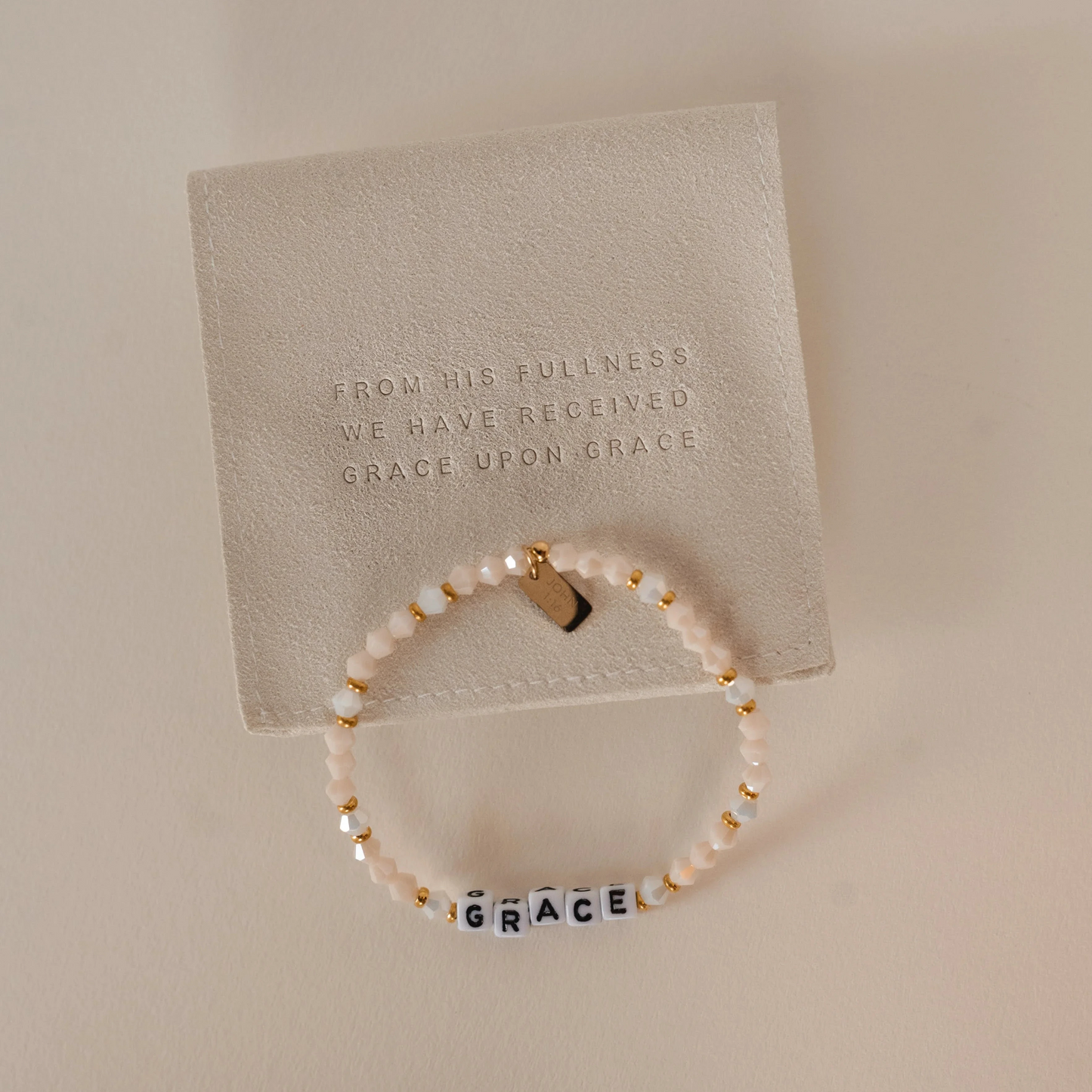 beaded bracelet with word GRACE on it and a gold tag with a bible verse. Christian women's jewelry. Faith based jewelry.