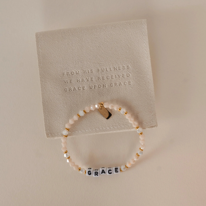 beaded bracelet with word GRACE on it and a gold tag with a bible verse. Christian women's jewelry. Faith based jewelry.
