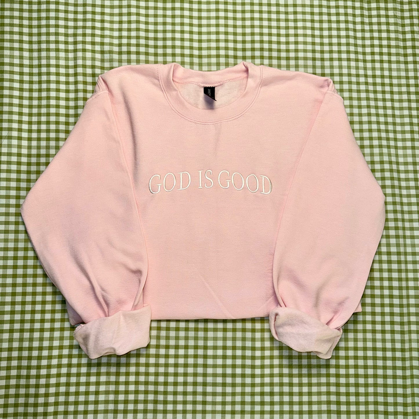 god is good pink christian crewneck. women's faith based apparel 
