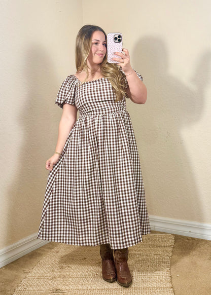 Maple brown and ivory gingham midi dress with a square neckline, puff sleeves, and a flattering smocked bodice.