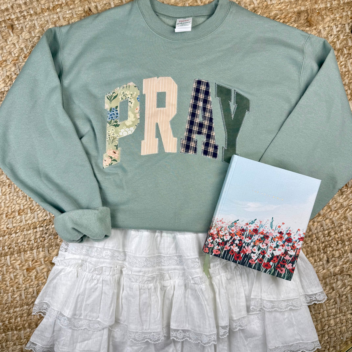 sage green crewneck with pray stiched on it in a patchwork design. christian women's outfits, church outfits, christian women fall outfits