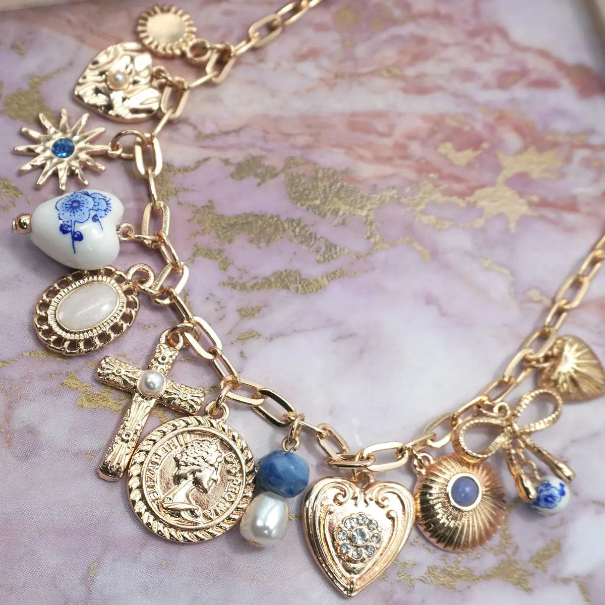 Gold and porcelain girly charm necklace.
