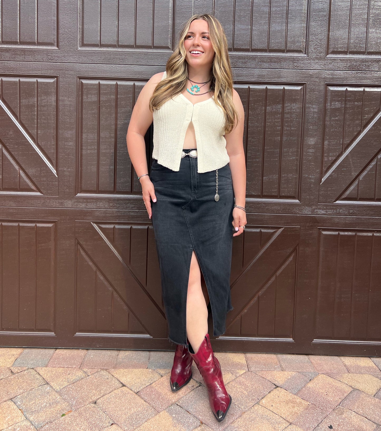 Black Denim midi skirt with front slit. Western fashion red cowgirl boots outfit