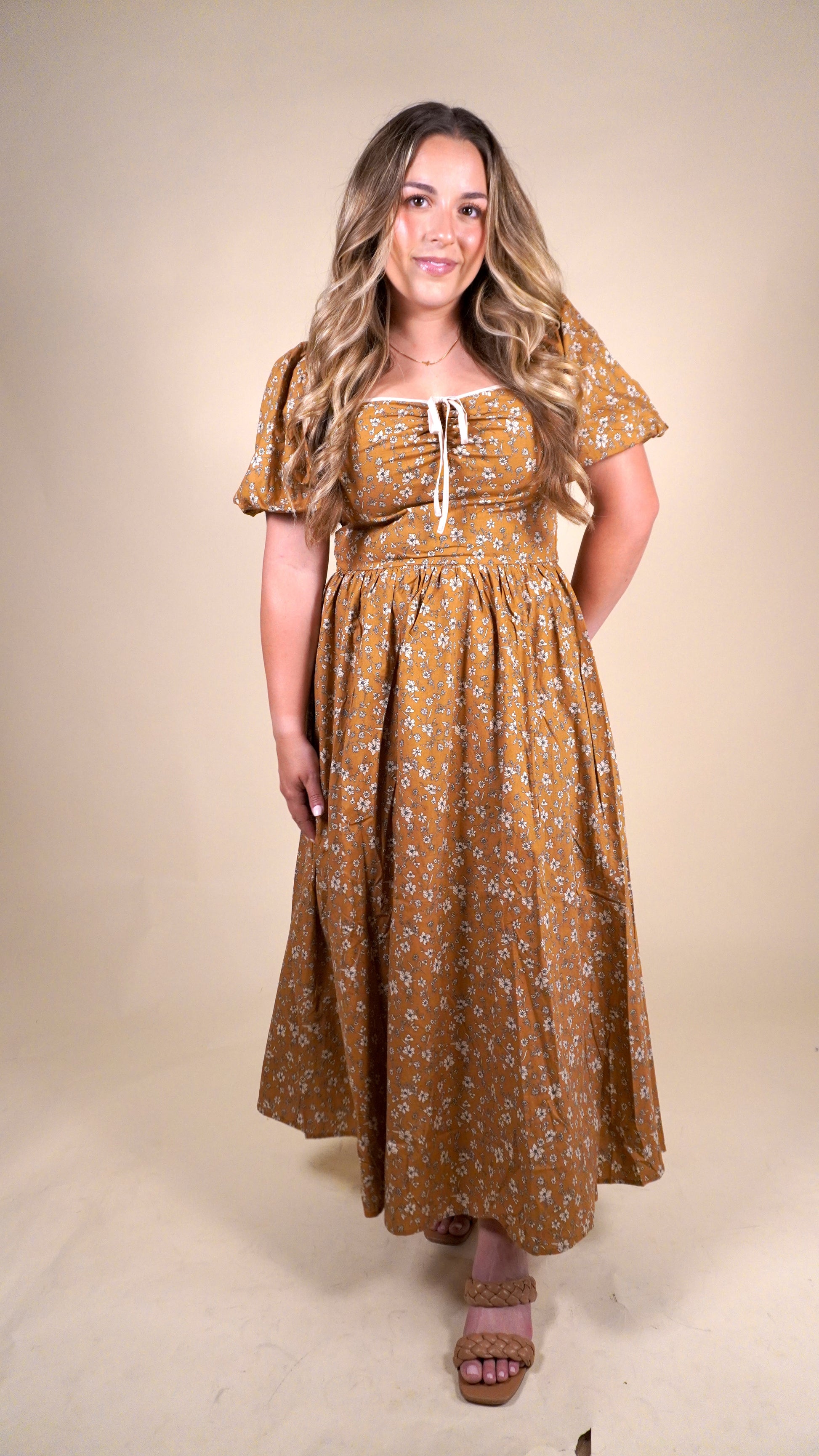 Fall orange and floral dress with puff sleeves and cream bow. perfect dress for thanksgiving gatherings or church service during the fall. 