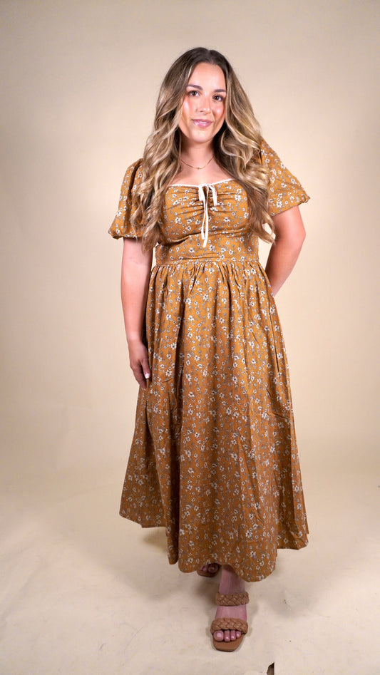 Fall orange and floral dress with puff sleeves and cream bow. perfect dress for thanksgiving gatherings or church service during the fall. 