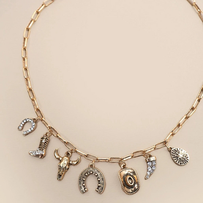 Necklace with various charms on a beige background
