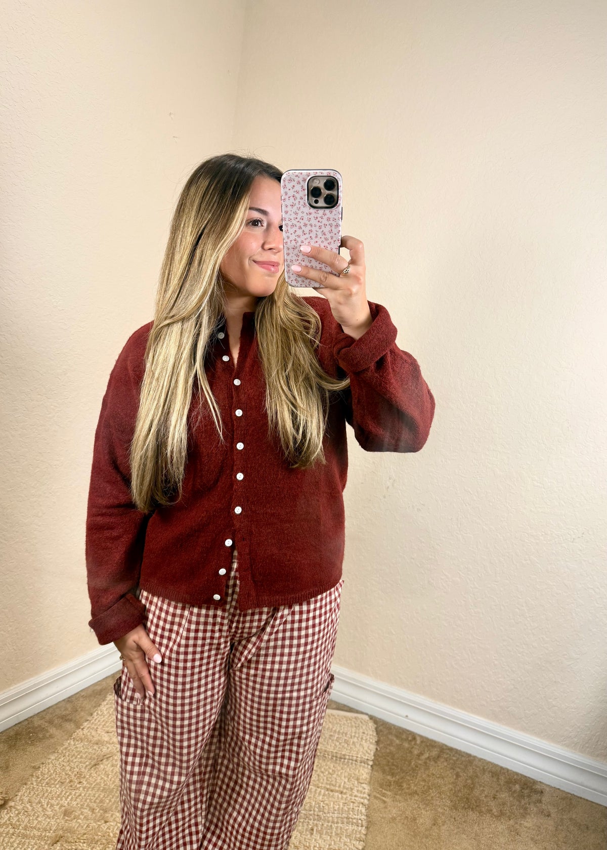 Close-up of soft burgundy button cardigan with front buttons