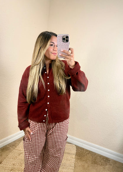 Close-up of soft burgundy button cardigan with front buttons
