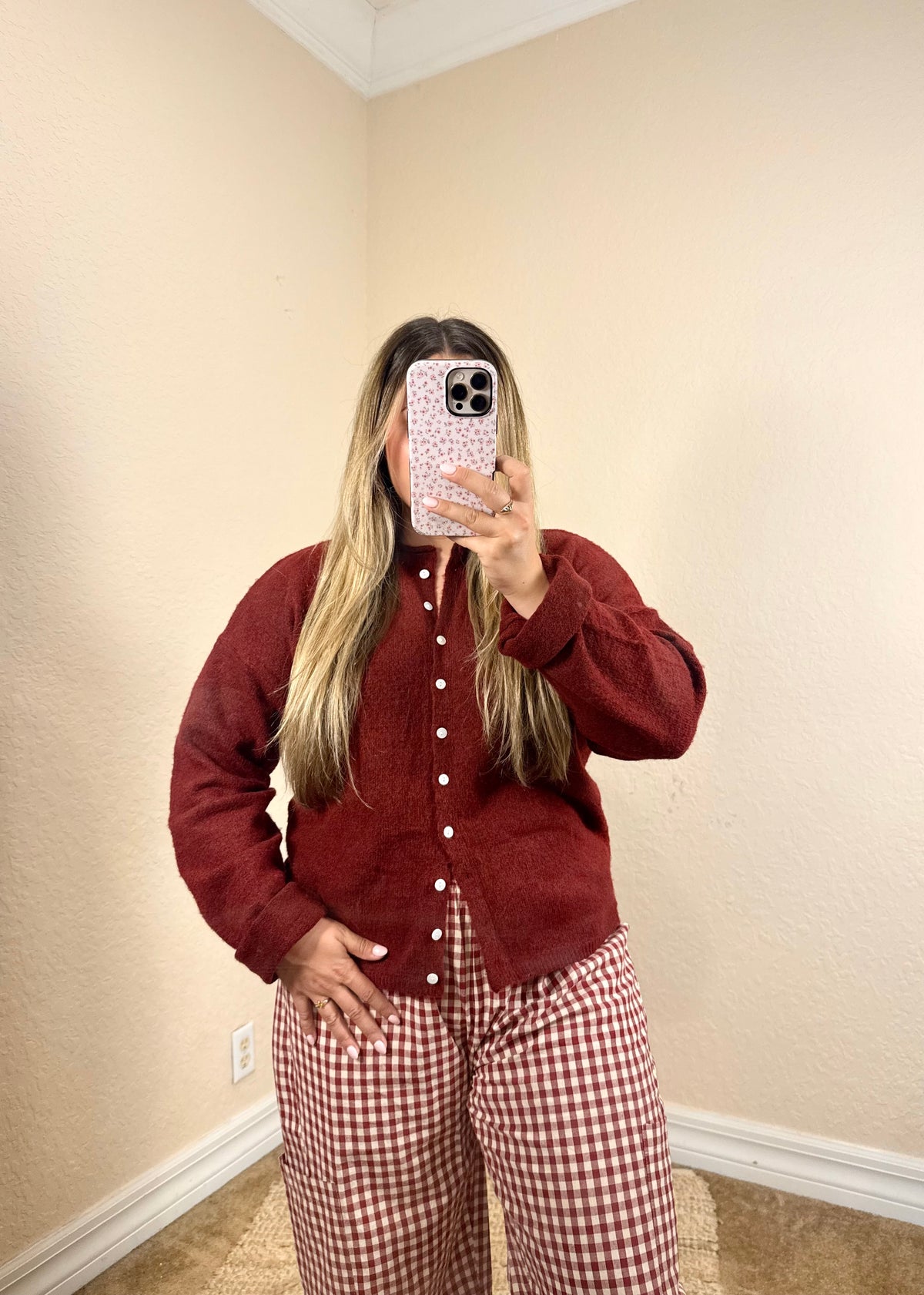 Burgundy cardigan paired with cherry red plaid pants for a fall outfit