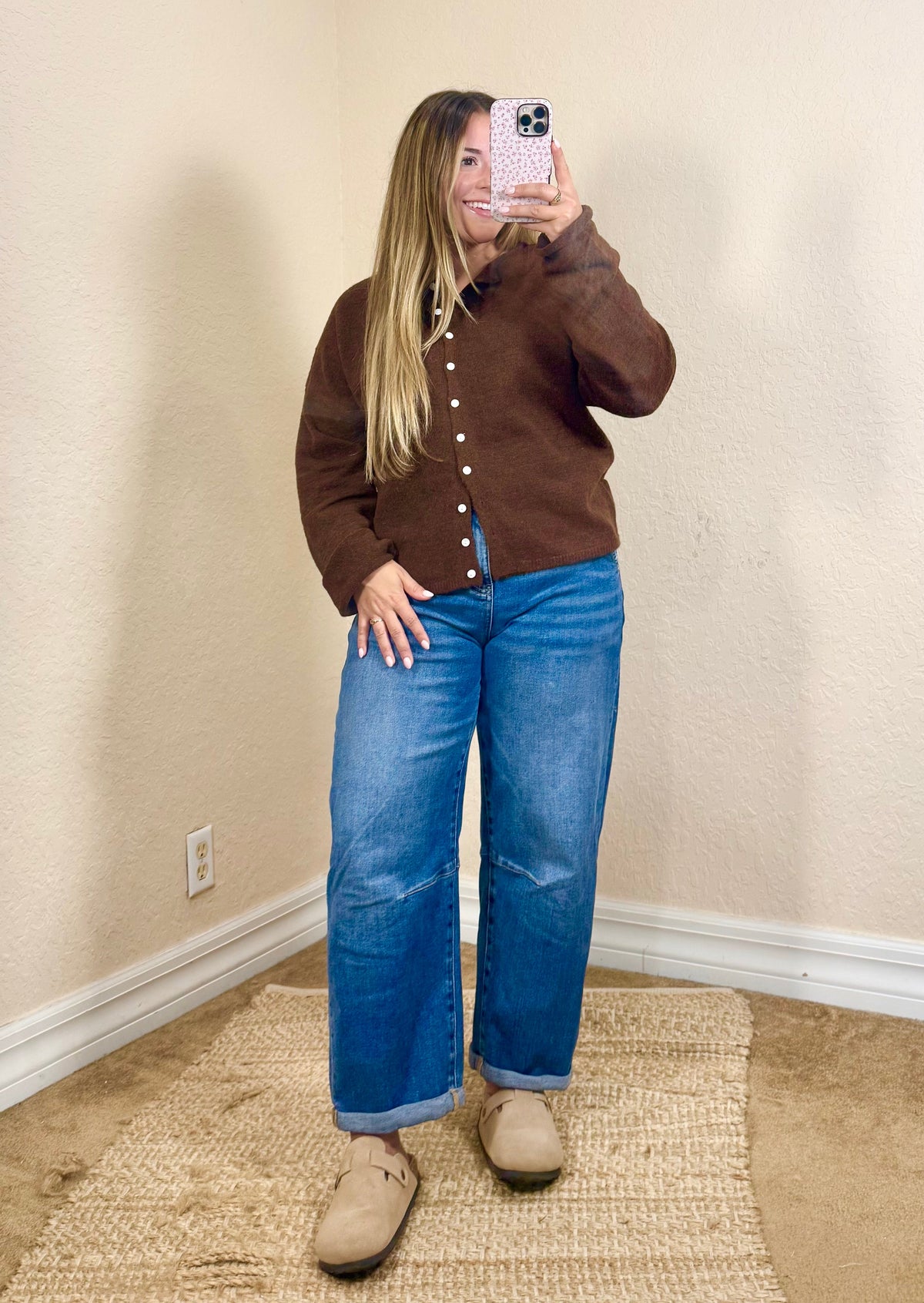 Woman wearing a chocolate brown button cardigan with jeans for a casual fall outfit