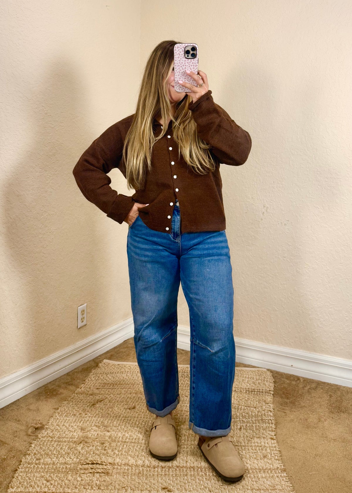 brown button down cardigan with medium wash barrel jeans