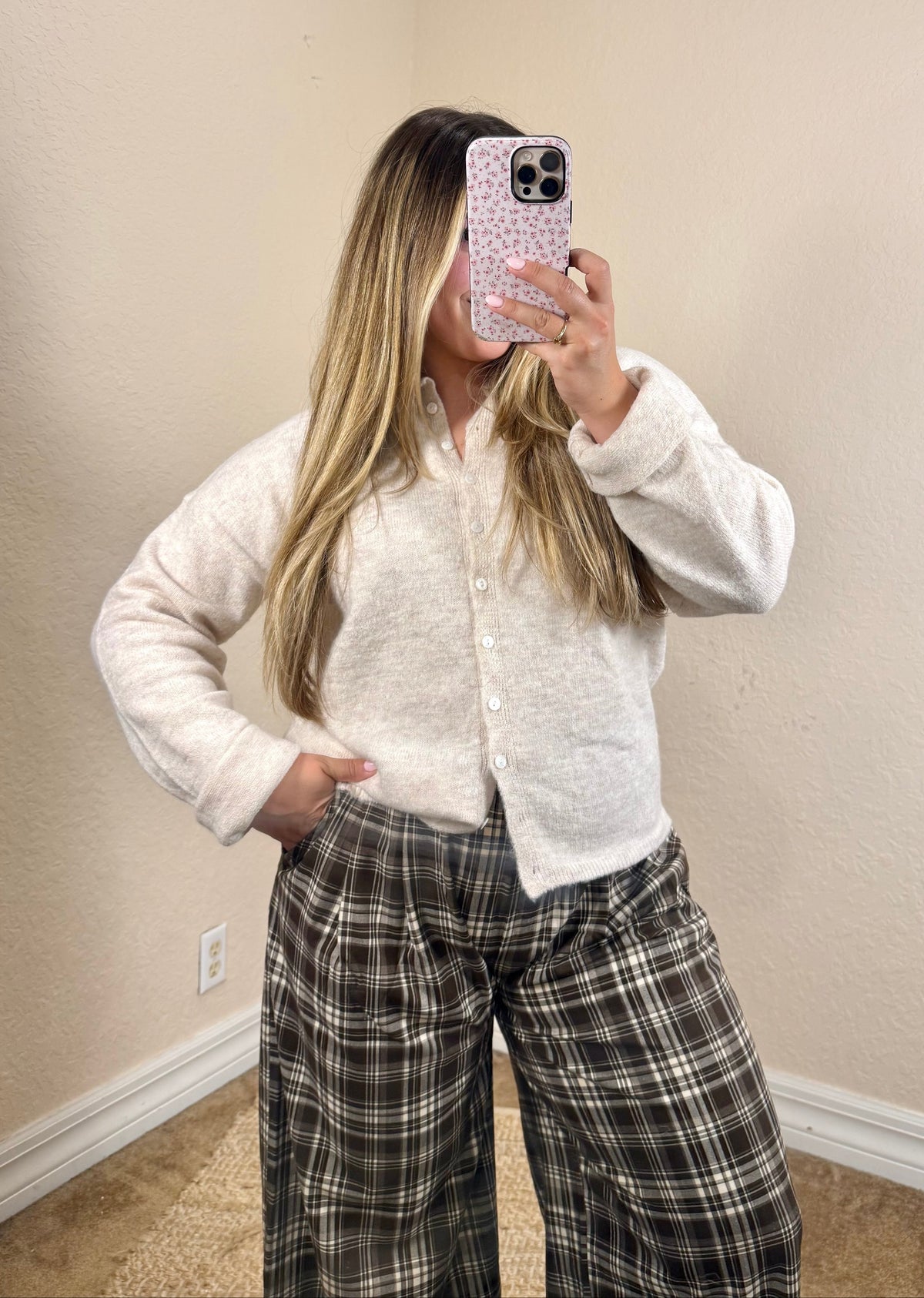 Woman wearing an oatmeal button cardigan with jeans for a casual fall outfit