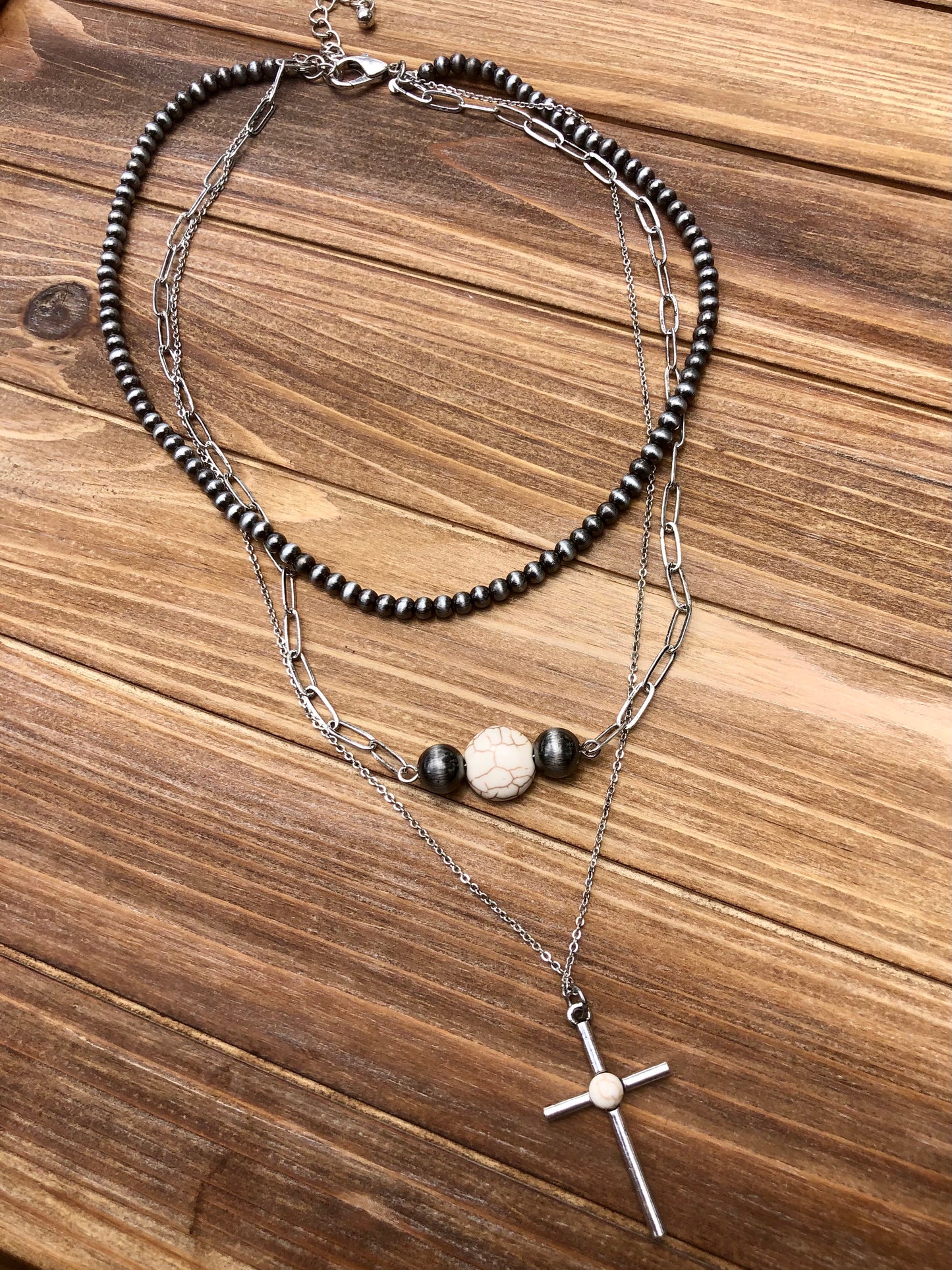 Faux white turquoise, silver and navajo pearl necklace. Western style jewelry. Necklace is shown as a layered stack but is still one individual necklace. Western faux turquoise jewelry 