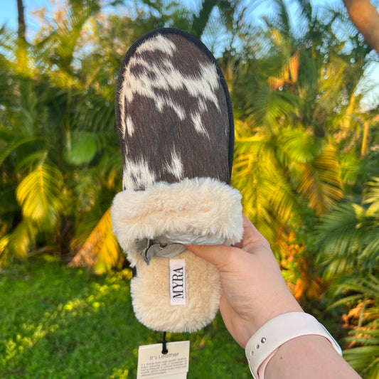 Genuine black and white cowhide slipper with fuzzy soft insole. Indoor and outdoor wear. Western cowhide slippers